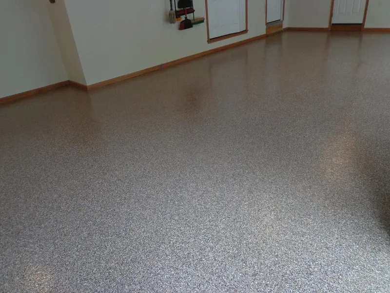 Flake coated garage floor with wood trim