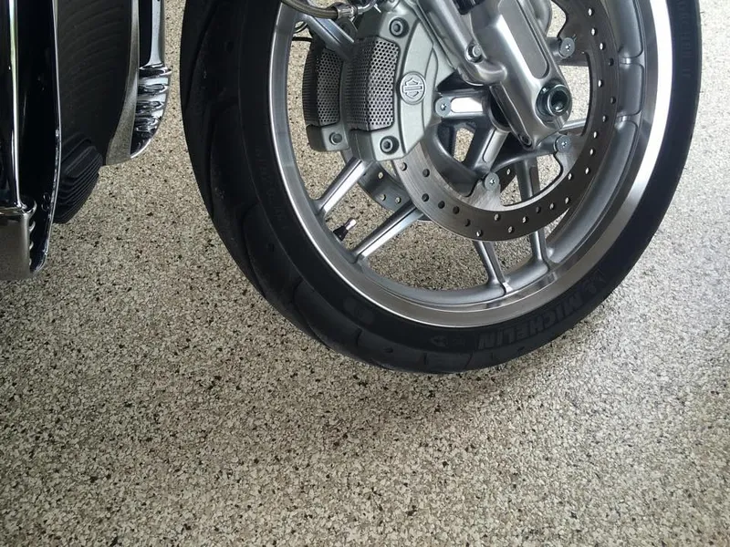 Motorcycle parked on a flake epoxy garage floor