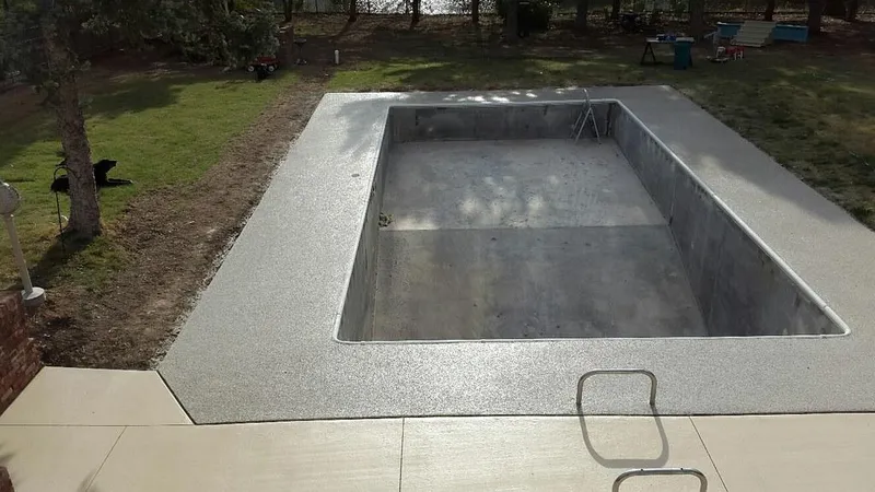 Freshly coated concrete pool surround